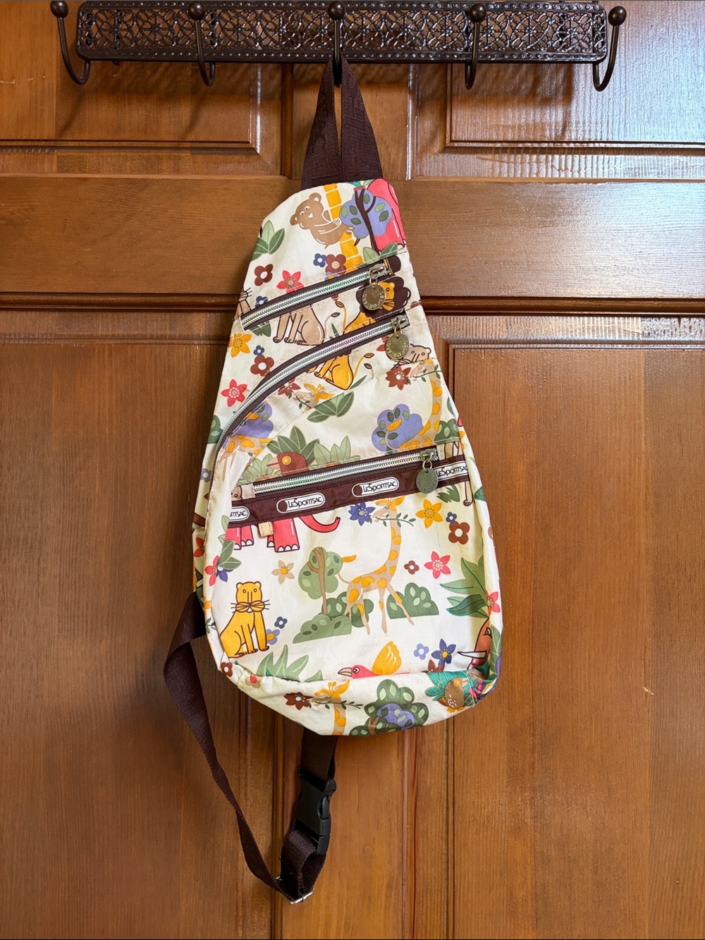 Lesportsac Cream Multi-Colored Jungle Print Sling Backpack with Brown Trim